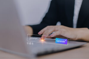 Close-up of a person’s hands using a laptop with a digital overlay of an AI prompt search bar and a "Generate" button